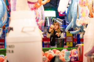 Girl playing milk churn 